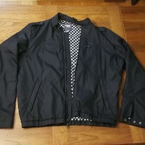 Black jacket with checkered reversible interior